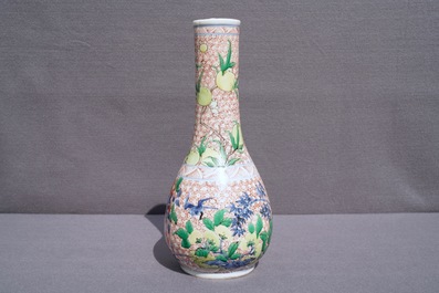 A Chinese wucai bottle vase with birds in a garden, Transitional period